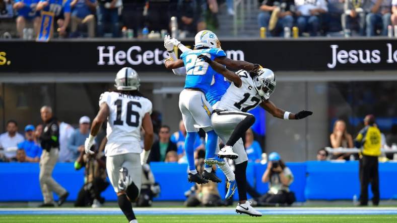 Oct 1, 2023; Inglewood, California, USA; Los Angeles Chargers cornerback Asante Samuel Jr. (26) blocks a pass intended for Las Vegas Raiders wide receiver Davante Adams (17) during the second half at SoFi Stadium. Mandatory Credit: Gary A. Vasquez-USA TODAY Sports