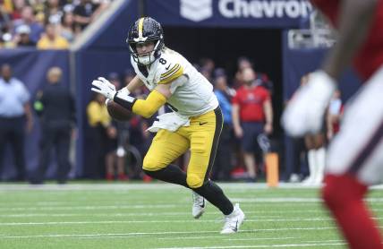 Oct 1, 2023; Houston, Texas, USA; Pittsburgh Steelers quarterback Kenny Pickett (8) rolls out of the pocket during the game against the Houston Texans at NRG Stadium. Mandatory Credit: Troy Taormina-USA TODAY Sports