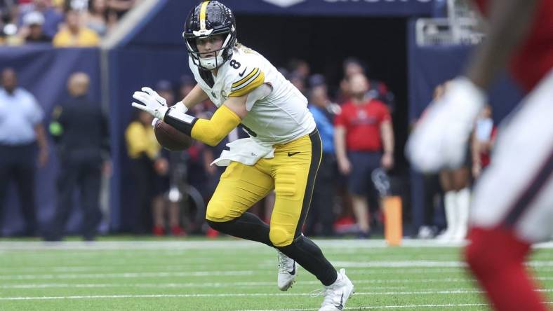 Oct 1, 2023; Houston, Texas, USA; Pittsburgh Steelers quarterback Kenny Pickett (8) rolls out of the pocket during the game against the Houston Texans at NRG Stadium. Mandatory Credit: Troy Taormina-USA TODAY Sports