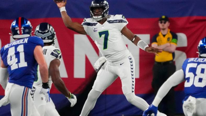 Oct 2, 2023; East Rutherford, New Jersey, USA; Seattle Seahawks quarterback Geno Smith (7) throws in the 1st half against the New York Giants at MetLife Stadium. Mandatory Credit: Robert Deutsch-USA TODAY Sports