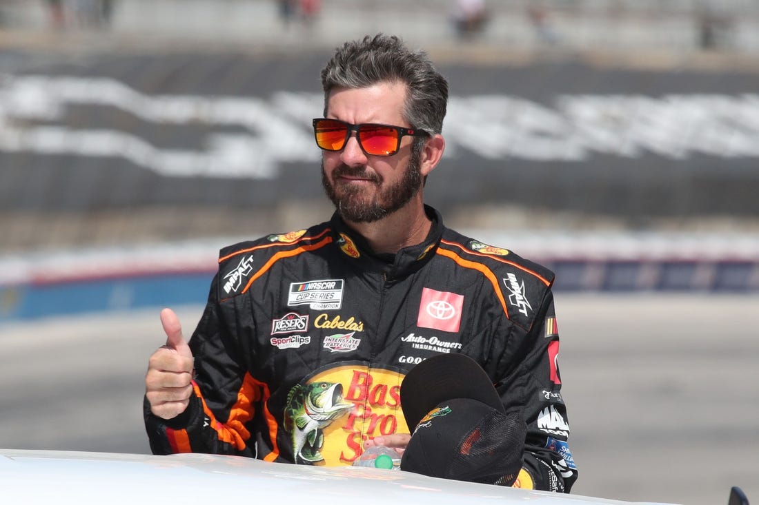 Sep 24, 2023; Fort Worth, Texas, USA;  NASCAR Cup Series driver  Martin Truex Jr. (19) during driver introductions before the AutoTrader EcoPark Automotive 400 at Texas Motor Speedway. Mandatory Credit: Michael C. Johnson-USA TODAY Sports