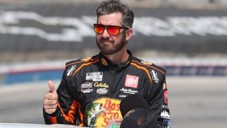 Sep 24, 2023; Fort Worth, Texas, USA;  NASCAR Cup Series driver  Martin Truex Jr. (19) during driver introductions before the AutoTrader EcoPark Automotive 400 at Texas Motor Speedway. Mandatory Credit: Michael C. Johnson-USA TODAY Sports