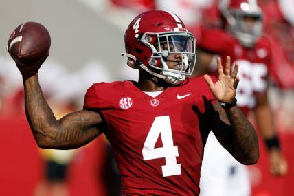 Sep 23, 2023; Tuscaloosa, Alabama, USA;  Alabama Crimson Tide quarterback Jalen Milroe (4) throws a pass against the Mississippi Rebels during the first half at Bryant-Denny Stadium. Mandatory Credit: Butch Dill-USA TODAY Sports