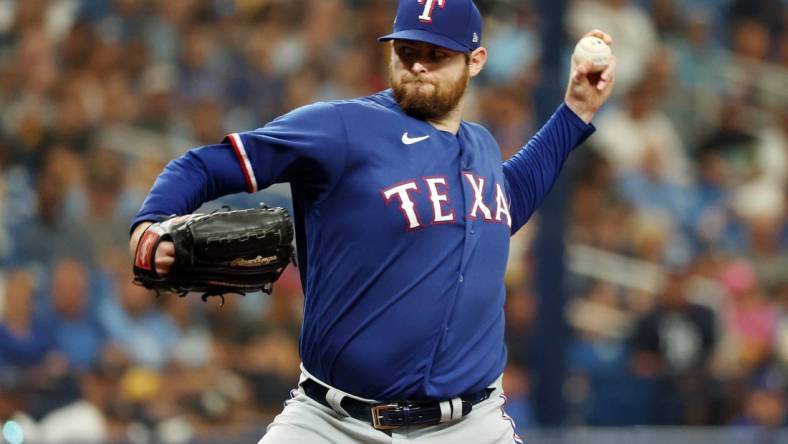 Oct 3, 2023; St. Petersburg, Florida, USA; Texas Rangers starting pitcher Jordan Montgomery (52) pitches against the Tampa Bay Rays in the second inning during game one of the Wildcard series for the 2023 MLB playoffs at Tropicana Field. Mandatory Credit: Kim Klement Neitzel-USA TODAY Sports