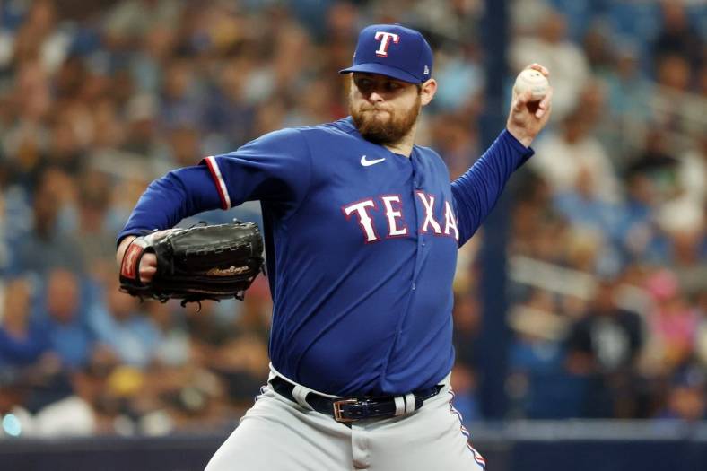 Oct 3, 2023; St. Petersburg, Florida, USA; Texas Rangers starting pitcher Jordan Montgomery (52) pitches against the Tampa Bay Rays in the second inning during game one of the Wildcard series for the 2023 MLB playoffs at Tropicana Field. Mandatory Credit: Kim Klement Neitzel-USA TODAY Sports