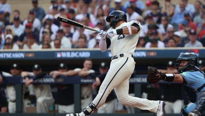 Oct 3, 2023; Minneapolis, Minnesota, USA; Minnesota Twins short stop Royce Lewis (23) hits a two-run home run in the first inning against the Toronto Blue Jays during game one of the Wildcard series for the 2023 MLB playoffs at Target Field. Mandatory Credit: Jesse Johnson-USA TODAY Sports