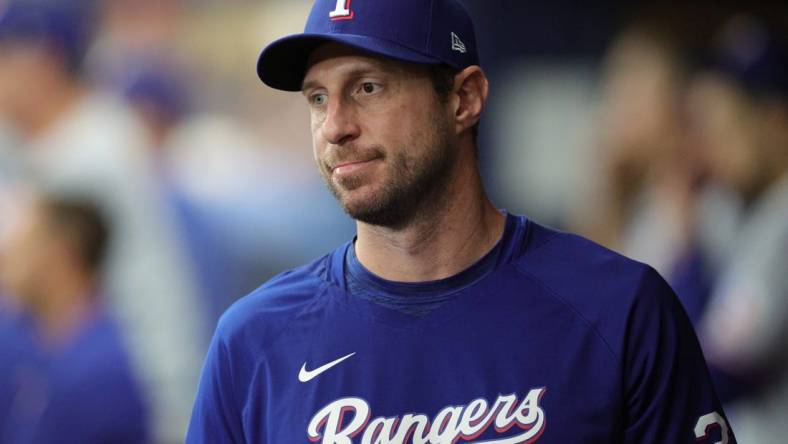 Oct 4, 2023; St. Petersburg, Florida, USA; Texas Rangers starting pitcher Max Scherzer (31) is seen in the dugout during game two of the Wildcard series for the 2023 MLB playoffs against the Tampa Bay Rays at Tropicana Field. Mandatory Credit: Nathan Ray Seebeck-USA TODAY Sports