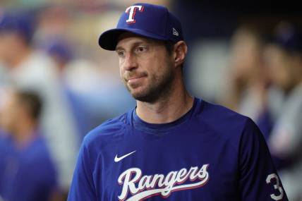 Oct 4, 2023; St. Petersburg, Florida, USA; Texas Rangers starting pitcher Max Scherzer (31) is seen in the dugout during game two of the Wildcard series for the 2023 MLB playoffs against the Tampa Bay Rays at Tropicana Field. Mandatory Credit: Nathan Ray Seebeck-USA TODAY Sports