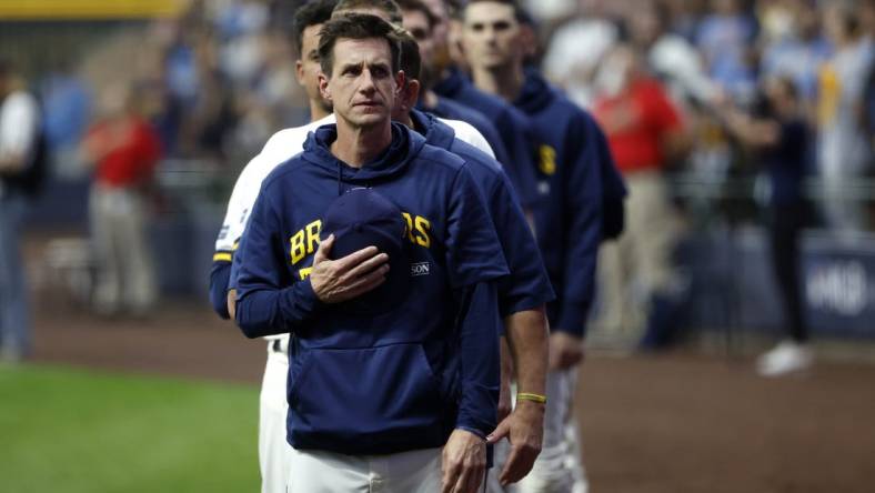 Oct 4, 2023; Milwaukee, Wisconsin, USA; Milwaukee Brewers manager Craig Counsell stands during the national anthem before game two against the Arizona Diamondbacks in the Wildcard series for the 2023 MLB playoffs at American Family Field. Mandatory Credit: Kamil Krzaczynski-USA TODAY Sports