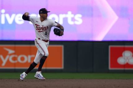 Oct 4, 2023; Minneapolis, Minnesota, USA; Minnesota Twins shortstop Carlos Correa (4) throws to first for an out in the eighth inning against the Toronto Blue Jays during game two of the Wildcard series for the 2023 MLB playoffs at Target Field. Mandatory Credit: Jesse Johnson-USA TODAY Sports
