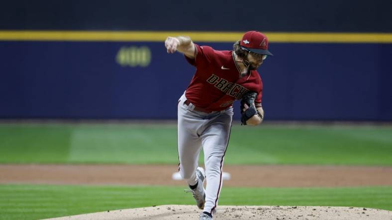 Oct 4, 2023; Milwaukee, Wisconsin, USA; Arizona Diamondbacks starting pitcher Zac Gallen (23) pitches against the Milwaukee Brewers in the first inning during game two of the Wildcard series for the 2023 MLB playoffs at American Family Field. Mandatory Credit: Kamil Krzaczynski-USA TODAY Sports