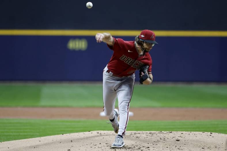Oct 4, 2023; Milwaukee, Wisconsin, USA; Arizona Diamondbacks starting pitcher Zac Gallen (23) pitches against the Milwaukee Brewers in the first inning during game two of the Wildcard series for the 2023 MLB playoffs at American Family Field. Mandatory Credit: Kamil Krzaczynski-USA TODAY Sports