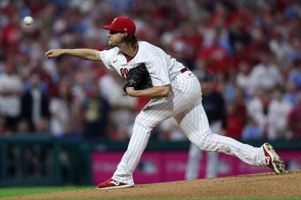 Oct 4, 2023; Philadelphia, Pennsylvania, USA; Philadelphia Phillies starting pitcher Aaron Nola (27) throws a pitch against the Miami Marlins during the first inning for game two of the Wildcard series for the 2023 MLB playoffs at Citizens Bank Park. Mandatory Credit: Bill Streicher-USA TODAY Sports