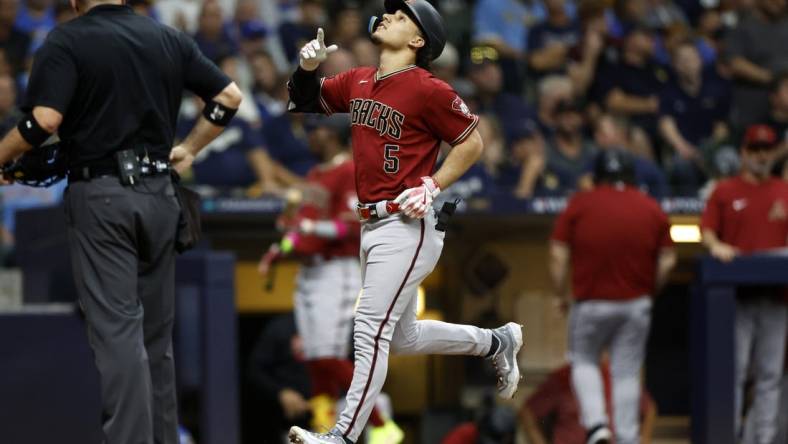 Oct 4, 2023; Milwaukee, Wisconsin, USA; Arizona Diamondbacks center fielder Alek Thomas (5) celebrates after hitting a home run in the fifth inning against the Milwaukee Brewers during game two of the Wildcard series for the 2023 MLB playoffs at American Family Field. Mandatory Credit: Kamil Krzaczynski-USA TODAY Sports