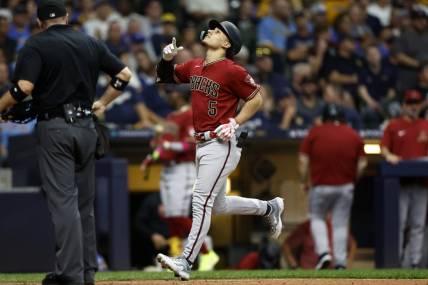 Oct 4, 2023; Milwaukee, Wisconsin, USA; Arizona Diamondbacks center fielder Alek Thomas (5) celebrates after hitting a home run in the fifth inning against the Milwaukee Brewers during game two of the Wildcard series for the 2023 MLB playoffs at American Family Field. Mandatory Credit: Kamil Krzaczynski-USA TODAY Sports