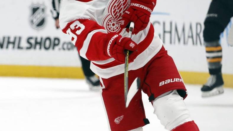 Oct 4, 2023; Pittsburgh, Pennsylvania, USA; Detroit Red Wings Detroit Red Wings right wing Alex DeBrincat (93) takes a slap shot against the Pittsburgh Penguins during the second period at PPG Paints Arena. Mandatory Credit: Charles LeClaire-USA TODAY Sports