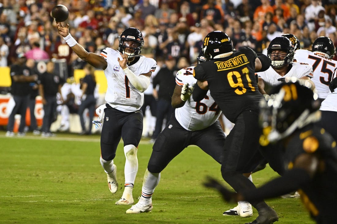 Chicago Bears quarterback Justin Fields throws during the first