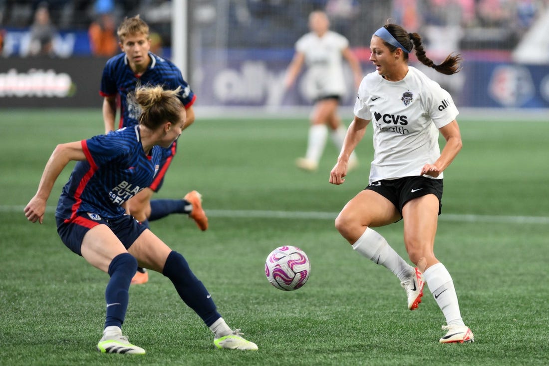 Oct 6, 2023; Seattle, Washington, USA; Washington Spirit forward Ashley Hatch (33) and OL Reign defender Emily Sonnett (2) battle for the ball during the second half at Lumen Field. Mandatory Credit: Steven Bisig-USA TODAY Sports