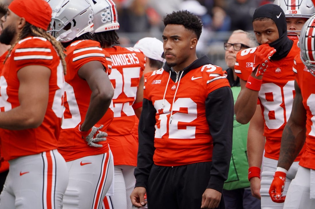 Ohio State running back TreVeyon Henderson watches warmups before the Buckeyes game against Maryland at Ohio Stadium on Oct. 7, 2023.