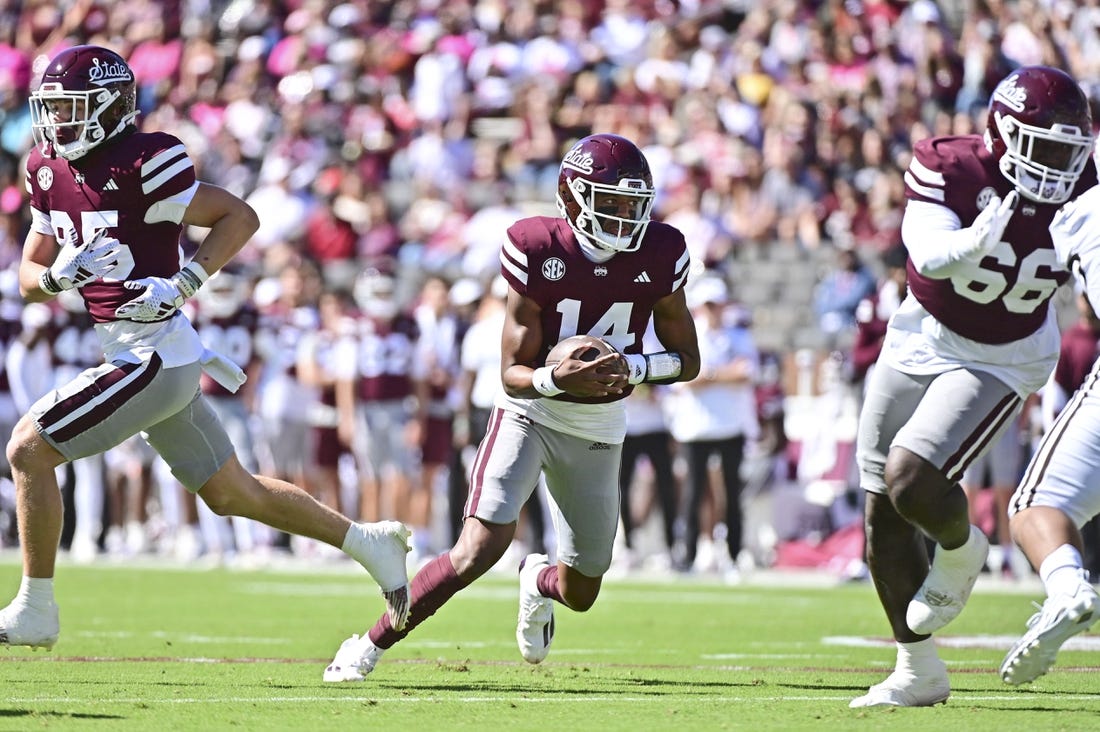 Oct 7, 2023; Starkville, Mississippi, USA; Mississippi State Bulldogs quarterback Mike Wright (14) runs the ball against the Western Michigan Broncos during the first quarter at Davis Wade Stadium at Scott Field. Mandatory Credit: Matt Bush-USA TODAY Sports