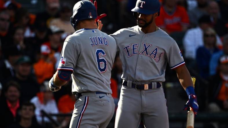 Oct 7, 2023; Baltimore, Maryland, USA; Texas Rangers third baseman Josh Jung (6) is congratulated by second baseman Marcus Semien (right) after hitting a home run against the Baltimore Orioles during the sixth inning in game one of the ALDS for the 2023 MLB playoffs at Oriole Park at Camden Yards. Mandatory Credit: Tommy Gilligan-USA TODAY Sports