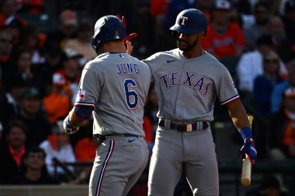 Oct 7, 2023; Baltimore, Maryland, USA; Texas Rangers third baseman Josh Jung (6) is congratulated by second baseman Marcus Semien (right) after hitting a home run against the Baltimore Orioles during the sixth inning in game one of the ALDS for the 2023 MLB playoffs at Oriole Park at Camden Yards. Mandatory Credit: Tommy Gilligan-USA TODAY Sports