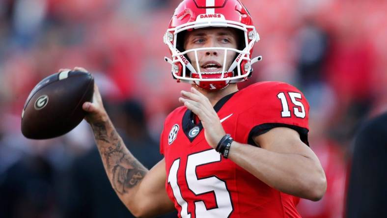 Georgia quarterback Carson Beck (15) warms up before the start of a NCAA college football game against Kentucky in Athens, Ga., on Saturday, Oct. 7, 2023.