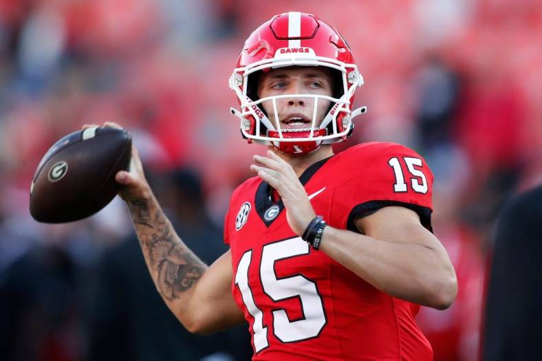 Georgia quarterback Carson Beck (15) warms up before the start of a NCAA college football game against Kentucky in Athens, Ga., on Saturday, Oct. 7, 2023.