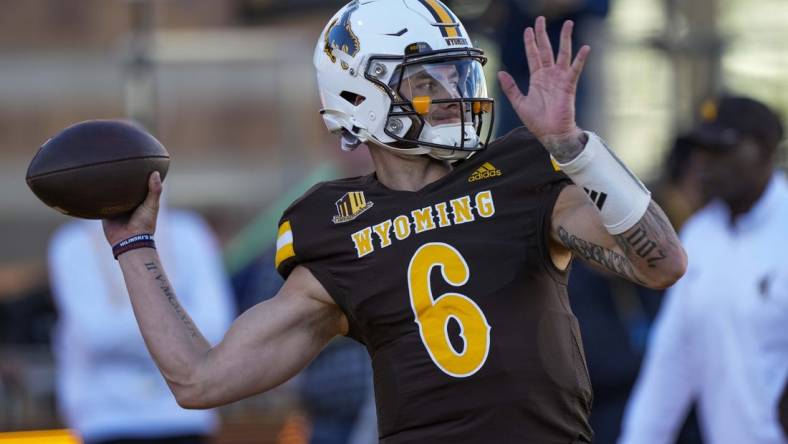 Oct 7, 2023; Laramie, Wyoming, USA; Wyoming Cowboys quarterback Andrew Peasley (6) warms up before game against the Fresno State Bulldogs at Jonah Field at War Memorial Stadium. Mandatory Credit: Troy Babbitt-USA TODAY Sports