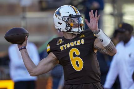 Oct 7, 2023; Laramie, Wyoming, USA; Wyoming Cowboys quarterback Andrew Peasley (6) warms up before game against the Fresno State Bulldogs at Jonah Field at War Memorial Stadium. Mandatory Credit: Troy Babbitt-USA TODAY Sports