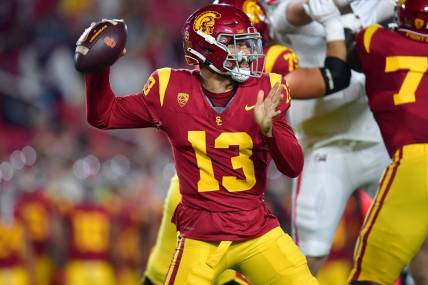 Oct 7, 2023; Los Angeles, California, USA; Southern California Trojans quarterback Caleb Williams (13) throws against the Arizona Wildcats during the first half at Los Angeles Memorial Coliseum. Mandatory Credit: Gary A. Vasquez-USA TODAY Sports