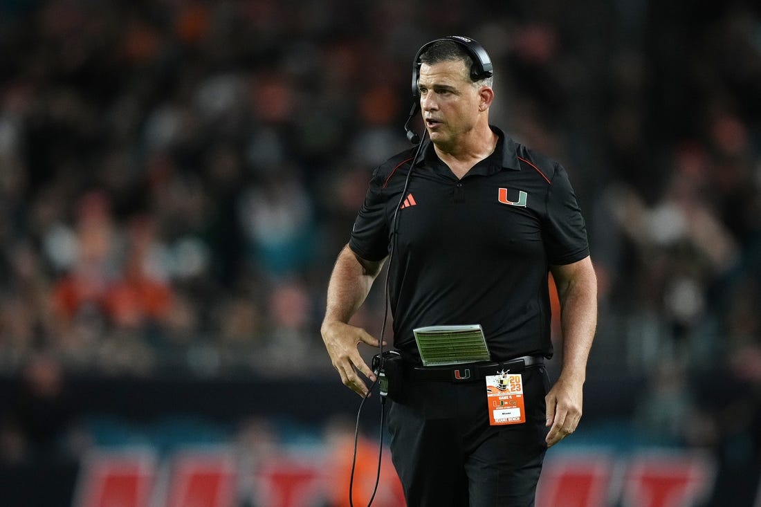 Oct 7, 2023; Miami Gardens, Florida, USA; Miami Hurricanes head coach Mario Cristobal walks on the field in the second half against the Georgia Tech Yellow Jackets at Hard Rock Stadium. Mandatory Credit: Jasen Vinlove-USA TODAY Sports