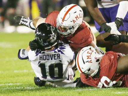 Iowa State Cyclones linebacker Zachary Lovett (0) takes down TCU Horned Frogs' quarterback Josh Hoover (10) during the third quarter in the Jack Trice Legacy Game at Jack Trice Stadium on Saturday, Oct. 7, 2023, in Ames, Iowa.