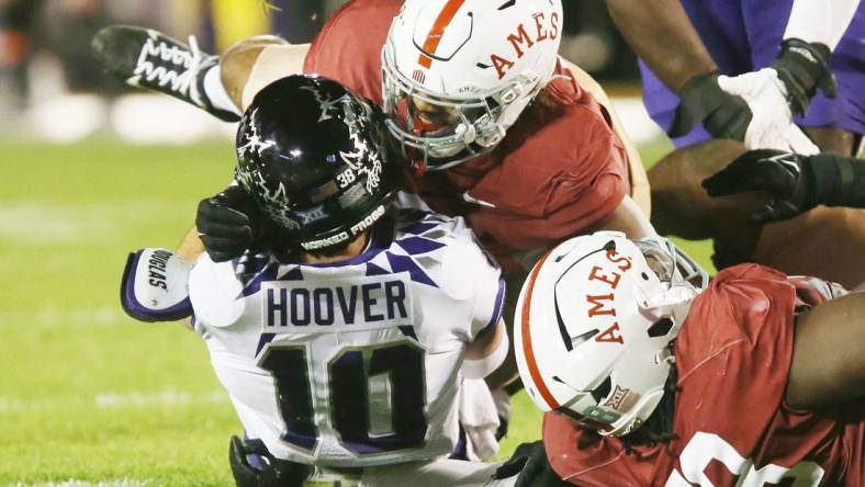 Iowa State Cyclones linebacker Zachary Lovett (0) takes down TCU Horned Frogs' quarterback Josh Hoover (10) during the third quarter in the Jack Trice Legacy Game at Jack Trice Stadium on Saturday, Oct. 7, 2023, in Ames, Iowa.