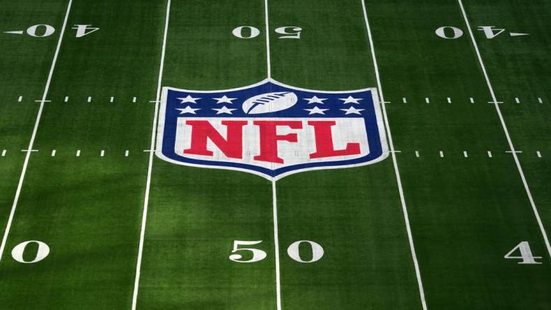 Oct 8, 2023; London United Kingdom, The NFL Shield logo at midfield at Tottenham Hotspur Stadium. Mandatory Credit: Kirby Lee-USA TODAY Sports