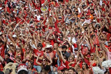 Oklahoma fans cheer during the Red River Rivalry college football game between the University of Oklahoma Sooners (OU) and the University of Texas (UT) Longhorns at the Cotton Bowl in Dallas, Saturday, Oct. 7, 2023. Oklahoma won 34-30.