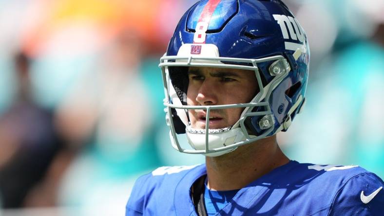 Oct 8, 2023; Miami Gardens, Florida, USA; New York Giants quarterback Daniel Jones (8) walks onto the field prior to the game against the New York Giants at Hard Rock Stadium. Mandatory Credit: Jasen Vinlove-USA TODAY Sports