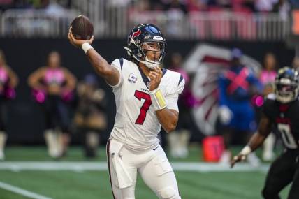 Oct 8, 2023; Atlanta, Georgia, USA; Houston Texans quarterback C.J. Stroud (7) passes against the Atlanta Falcons during the first half at Mercedes-Benz Stadium. Mandatory Credit: Dale Zanine-USA TODAY Sports