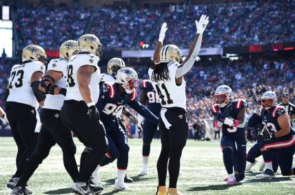 Oct 8, 2023; Foxborough, Massachusetts, USA; New Orleans Saints running back Alvin Kamara (41) reacts after scoring a touchdown during the first half against the New England Patriots at Gillette Stadium. Mandatory Credit: Bob DeChiara-USA TODAY Sports