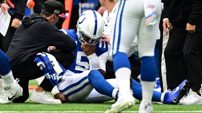 Oct 8, 2023; Indianapolis, Indiana, USA; Indianapolis Colts quarterback Anthony Richardson (5) sits on the field with a shoulder injury during the second quarter against the Tennessee Titans at Lucas Oil Stadium. Mandatory Credit: Marc Lebryk-USA TODAY Sports