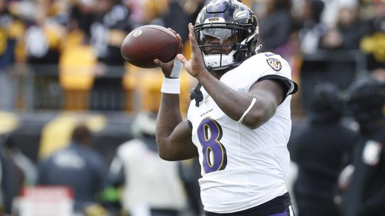 Oct 8, 2023; Pittsburgh, Pennsylvania, USA; Baltimore Ravens quarterback Lamar Jackson (8) warms up before the game against the Pittsburgh Steelers at Acrisure Stadium. Mandatory Credit: Charles LeClaire-USA TODAY Sports