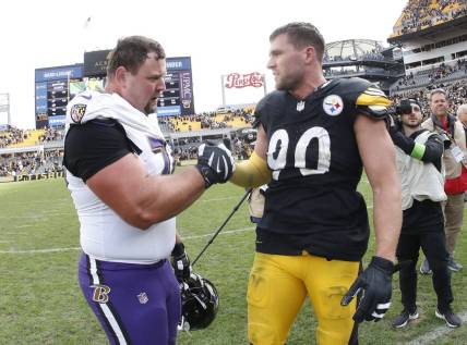 Oct 8, 2023; Pittsburgh, Pennsylvania, USA; Baltimore Ravens guard Kevin Zeitler (70) and Pittsburgh Steelers linebacker T.J. Watt (90) shake hands after their game at Acrisure Stadium. Pittsburgh won 17-10. Mandatory Credit: Charles LeClaire-USA TODAY Sports