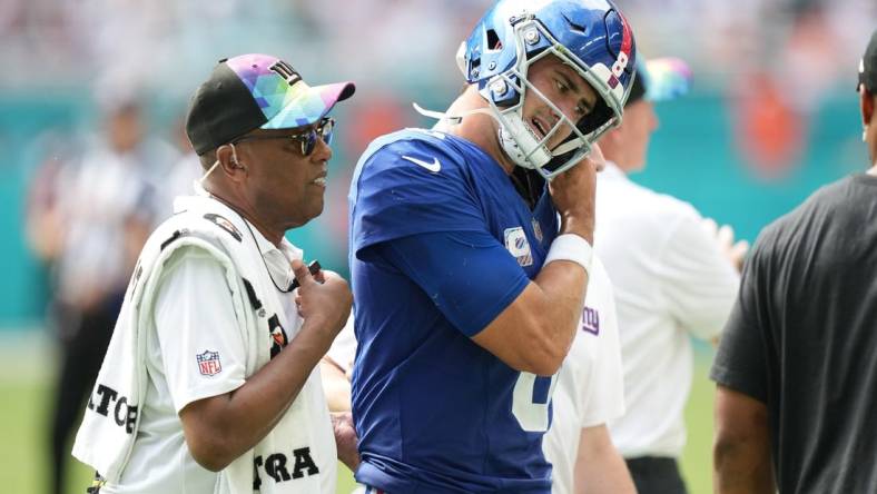 New York Giants quarterback Daniel Jones (8) leaves the game with an injury against the Miami Dolphins during the second half of an NFL game at Hard Rock Stadium in Miami Gardens, October 8, 2023.