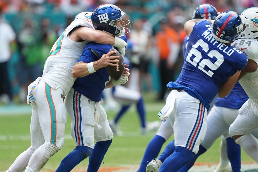 Miami Dolphins linebacker Andrew Van Ginkel (43) sacks New York Giants quarterback Daniel Jones (8) during the second half of an NFL game at Hard Rock Stadium in Miami Gardens, October 8, 2023.