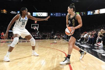 Oct 8, 2023; Las Vegas, Nevada, USA; New York Liberty forward Jonquel Jones (35) defends against Las Vegas Aces guard Kelsey Plum (10) in the second half during game one of the 2023 WNBA Finals at Michelob Ultra Arena. Mandatory Credit: Candice Ward-USA TODAY Sports