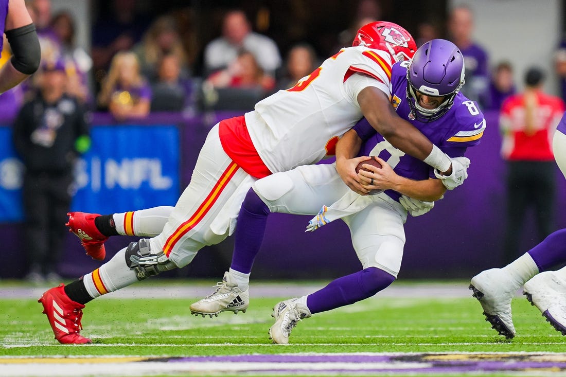 Oct 8, 2023; Minneapolis, Minnesota, USA; Kansas City Chiefs defensive tackle Chris Jones (95) sacks Minnesota Vikings quarterback Kirk Cousins (8) in the second quarter at U.S. Bank Stadium. Mandatory Credit: Brad Rempel-USA TODAY Sports