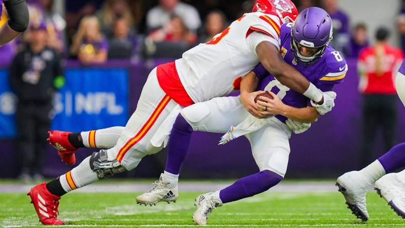 Oct 8, 2023; Minneapolis, Minnesota, USA; Kansas City Chiefs defensive tackle Chris Jones (95) sacks Minnesota Vikings quarterback Kirk Cousins (8) in the second quarter at U.S. Bank Stadium. Mandatory Credit: Brad Rempel-USA TODAY Sports