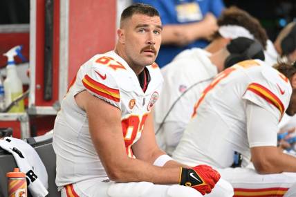 Oct 8, 2023; Minneapolis, Minnesota, USA; Kansas City Chiefs tight end Travis Kelce (87) looks on from the bench against the Minnesota Vikings during the second quarter at U.S. Bank Stadium. Mandatory Credit: Jeffrey Becker-USA TODAY Sports