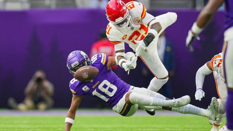 Oct 8, 2023; Minneapolis, Minnesota, USA; Kansas City Chiefs safety Mike Edwards (21) breaks up a pass to Minnesota Vikings wide receiver Justin Jefferson (18) in the third quarter at U.S. Bank Stadium. Mandatory Credit: Brad Rempel-USA TODAY Sports