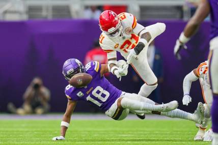 Oct 8, 2023; Minneapolis, Minnesota, USA; Kansas City Chiefs safety Mike Edwards (21) breaks up a pass to Minnesota Vikings wide receiver Justin Jefferson (18) in the third quarter at U.S. Bank Stadium. Mandatory Credit: Brad Rempel-USA TODAY Sports